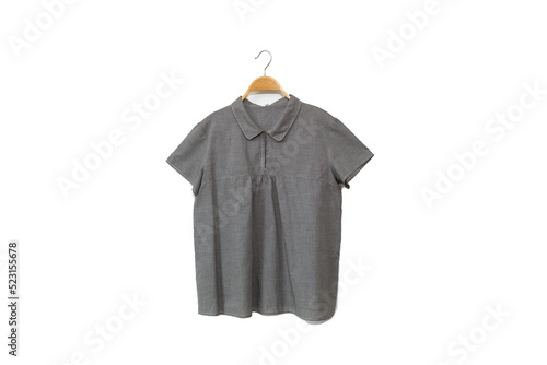 Gray colour blouse is clothes hanger on white background.close up.