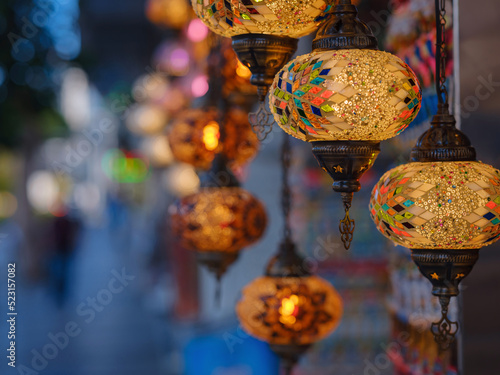 Colorful Turkish hanging lights of different colors and sizes. Turkish mosaic lambs. glass mosaic lamp in grand bazaar. Hand made mosaic vintage ottoman lambs and bokeh.