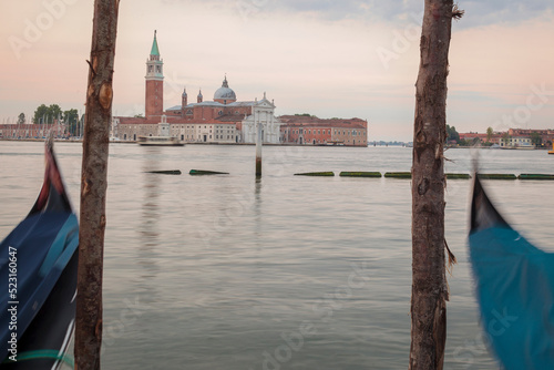 Venezia. Gondole ormeggiate al Molo di Palazzo Ducale verso l' isola di San Giorgio Maggiore photo