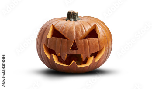 A carved halloween pumpkin with evil eyes and face isolated on white.