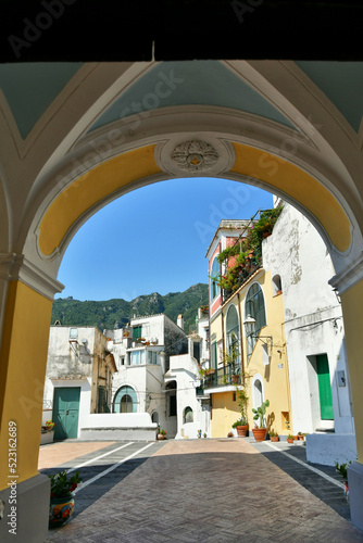 Houses of the village of Albori seen from the arch of a church, in the province of Salerno in Italy.
