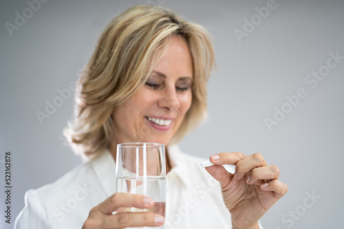 Woman Taking Medication Or Drugs