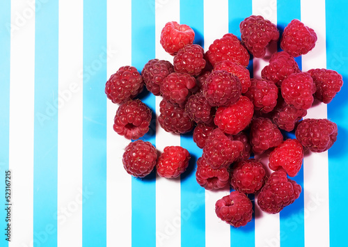 Raspberries on a striped background
