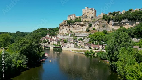 Aerial view Beynac castle and canoes on the river dordogne perigord France, High quality video