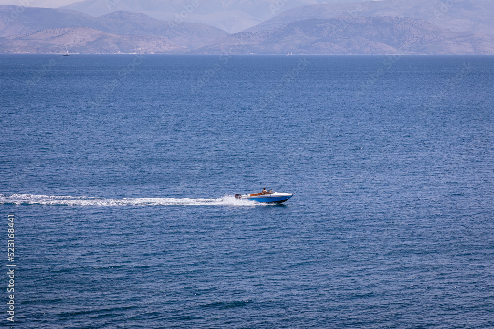Powerboat seen from Mon Repos park in Corfu town, Corfu Island, Greece