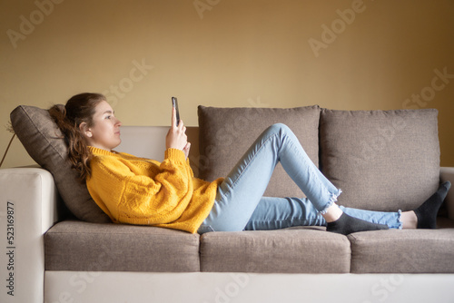 young woman resting on her sofa