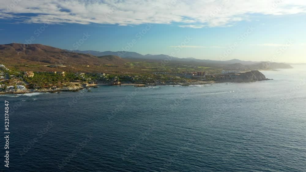 Aerial Beautiful Shot Of Hotels By Beach, Drone Flying Forward Over Sea - Cabo San Lucas, Mexico Aerial Beautiful Shot Of Hotels By Beach, Drone Flying Forward Over Sea - Cabo San Lucas, Mexico