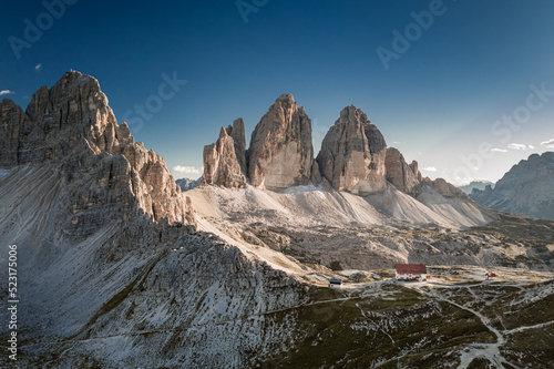 Majestic aerial view of Tre Cime and mountain shelter, Dolomites
