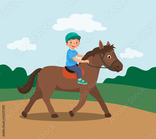 cute little boy riding a horse at the park