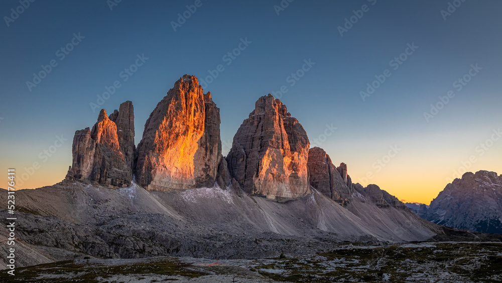 Naklejka premium Tre Cime peaks at sunset in Dolomites in Italy