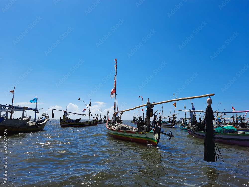 traditional boats on the harbor in the mid day