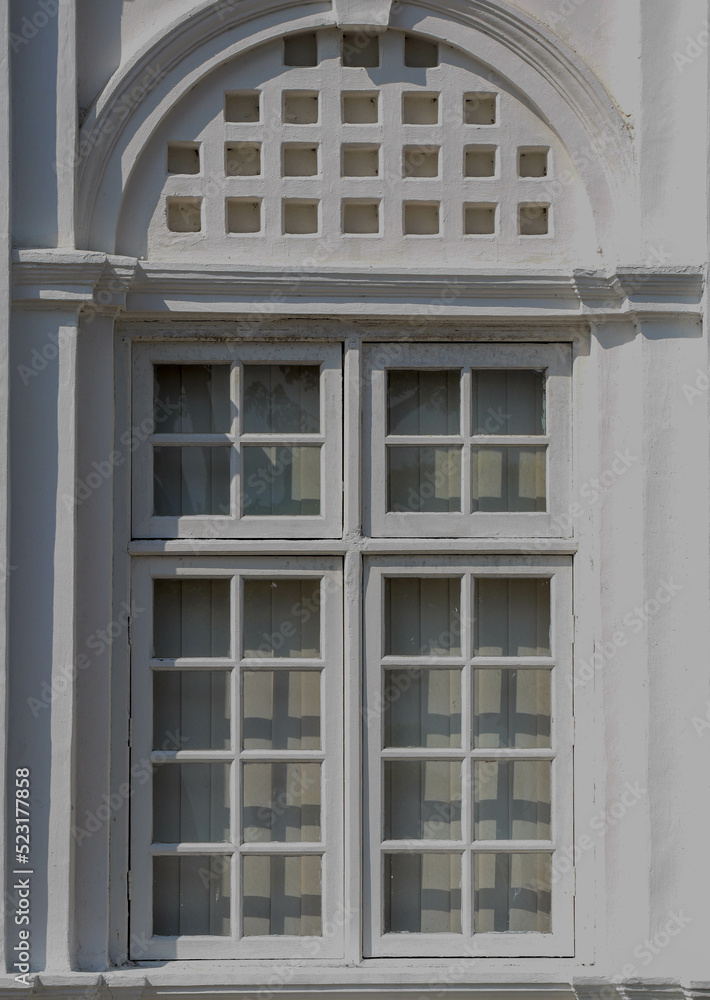 Obraz premium unique and antique window of a heritage building