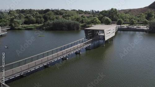 Wooden bridge over the lake in the park