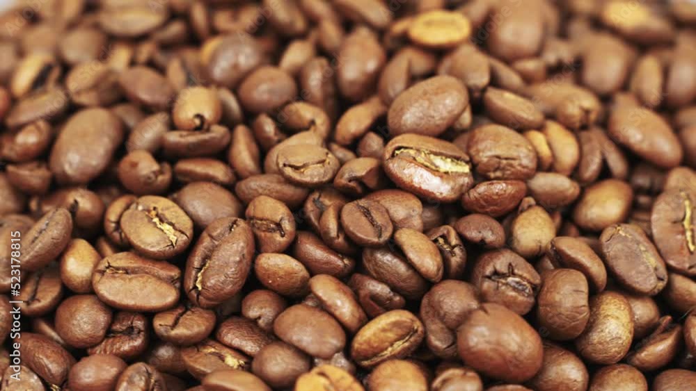 Coffee beans close-up rotate around an axis. Beautiful coffee seeds. Coffee beans close-up rotate around an axis. Beautiful coffee seeds.