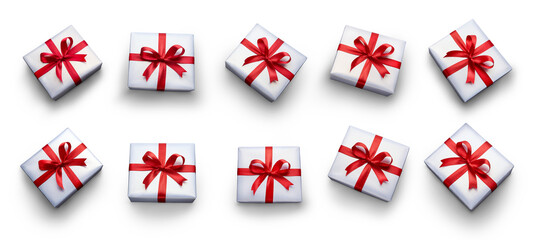 Top view of Christmas, birthday presents wrapped in white paper with red ribbon and bow decoration isolated against a transparent background.