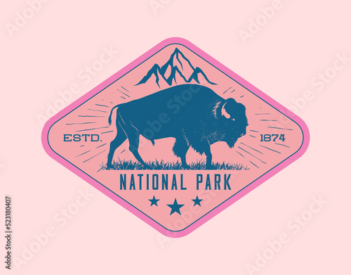 Vintage retro wildlife badge or label design template with bison or buffalo bull and mountain peak on background. Vector illustration