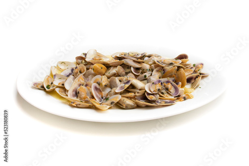 Dish of coquinas with garlic. The coquina (Donax trunculus) is a headless bivalve mollusc of the Donacidae family. Isolated on white background. Spanish food concept.