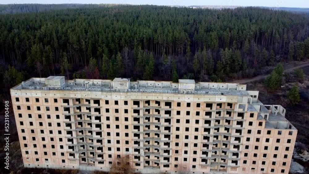 Drone takeoff over a large unfinished house on the edge of the forest Drone takeoff over a large unfinished house on the edge of the forest