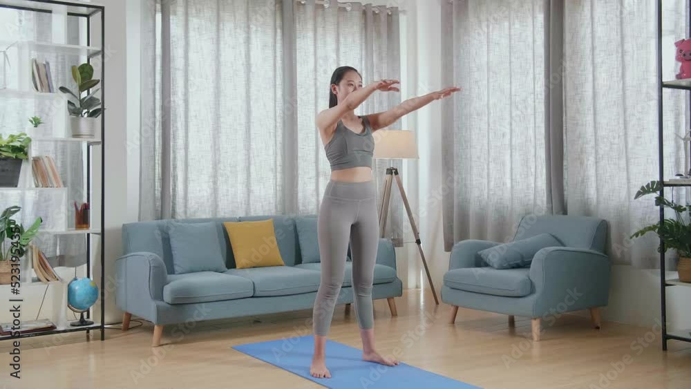 Young Asian Athletic Female In Sports Clothes Doing Butt Workout Squats On The Mat At Home
Young Asian Athletic Female In Sports Clothes Doing Butt Workout Squats On The Mat At Home