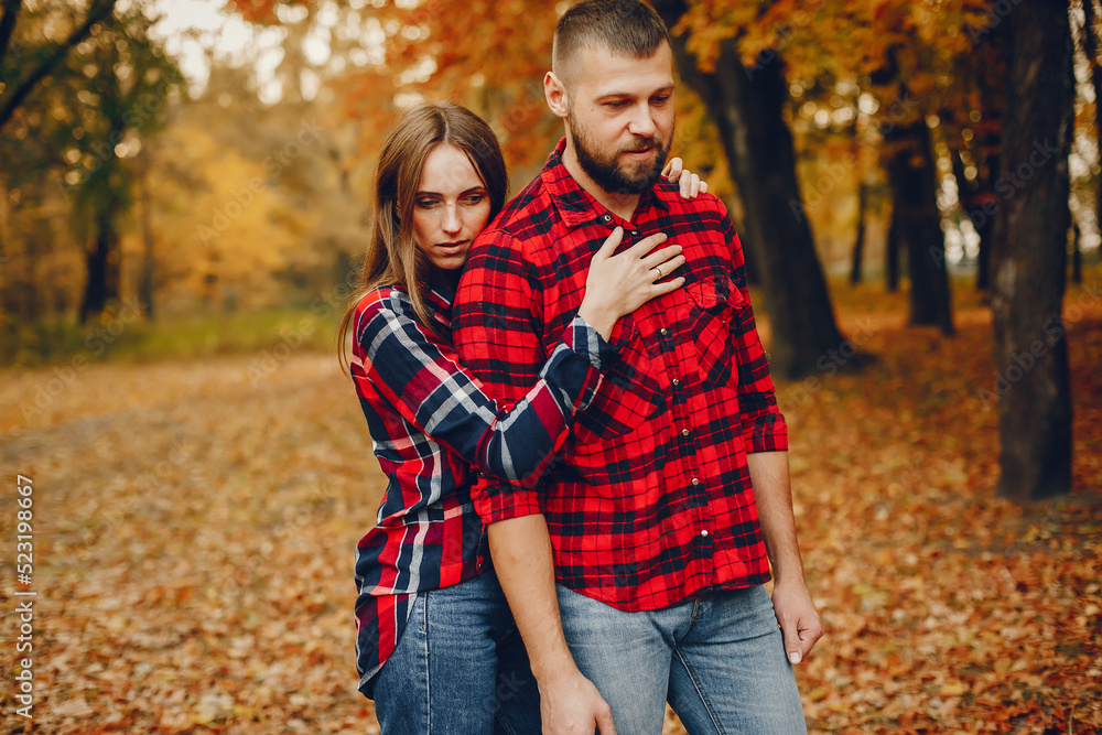 Elegant couple spend time in a autumn park Elegant couple spend time in a autumn park