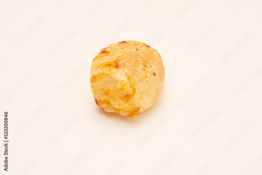 A single Minas Gerais cheese bread, isolated, hot, on a white background, copy space