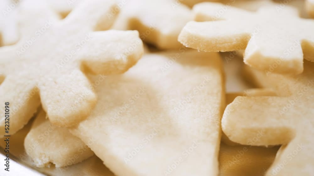 Pile of freshly baked sugar cookies in snowflake shape. Pile of freshly baked sugar cookies in snowflake shape.
