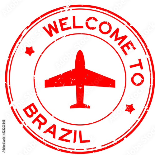 Grunge red welcome to Brazil word with airplane icon round rubber seal stamp on white background