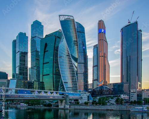 Moscow City skyscrapers on the river, business center summer evening Russia