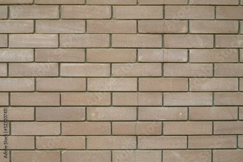 Brick wall of a house as a background, bricks as texture