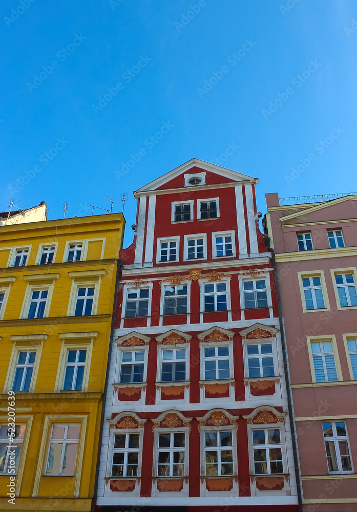 old town hall building with a clock in the center on Wroclaw Square Poland