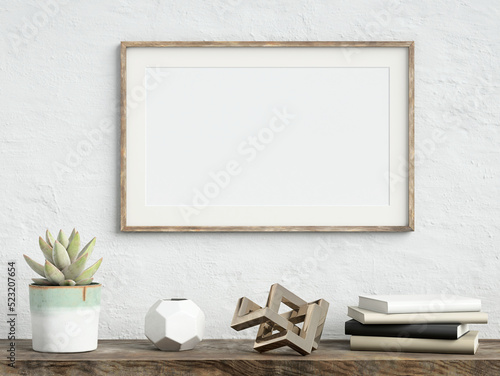 Mock up poster frame on white plaster wall with echeveria plant in a pot, books and geometric object on old wooden table; landscape orientation; stylish frame mock up; 3d rendering, 3d illustration
