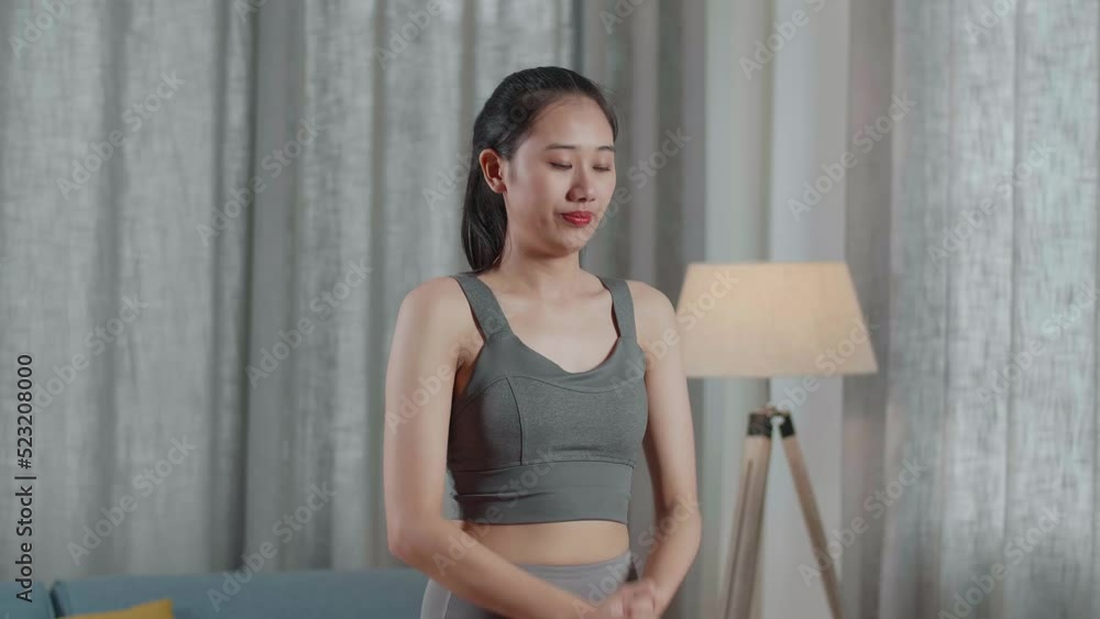 Young Asian Trainer Female In Sports Clothes Speaking And Doing Cardio High Knees While Teaching Exercise At Home
Young Asian Trainer Female In Sports Clothes Speaking And Doing Cardio High Knees While Teaching Exercise At Home