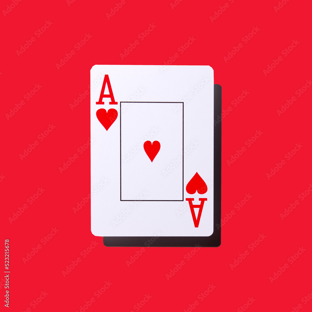 Obraz premium Poker card - heart ace isolated on a red background