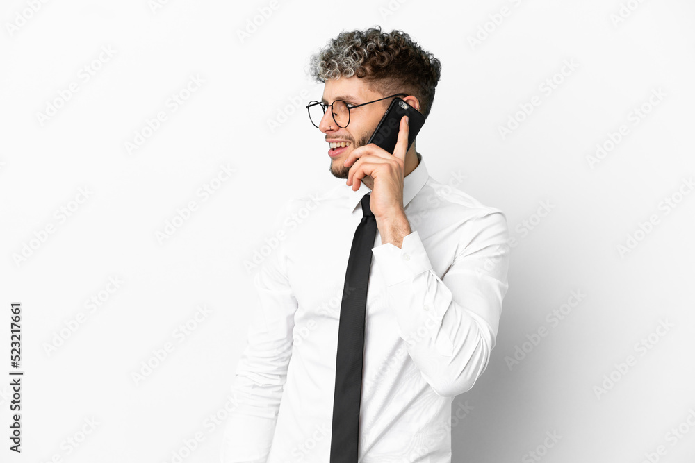 Business caucasian man isolated on white background keeping a conversation with the mobile phone with someone Business caucasian man isolated on white background keeping a conversation with the mobile phone with someone