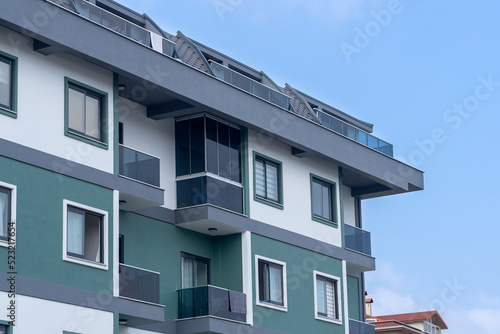 Modern multi-apartment residential building. New multi-storey building. © Amerigo_images