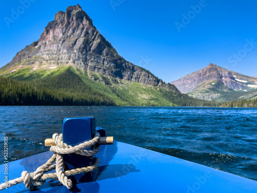 Bow of tour boat traveling across Two Medicine Lake, Glacier National Park, Montana, USA photo