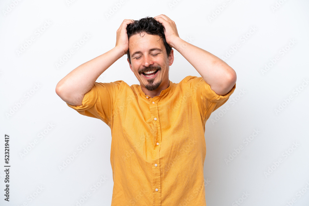 Young man with moustache isolated on white background laughing Young man with moustache isolated on white background laughing
