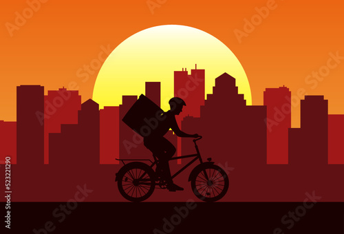 The silhouette of courier on bicycle with backpack on the background of the city. Deliveryman driving a bike at sunset. Online delivery service concept vector illustration