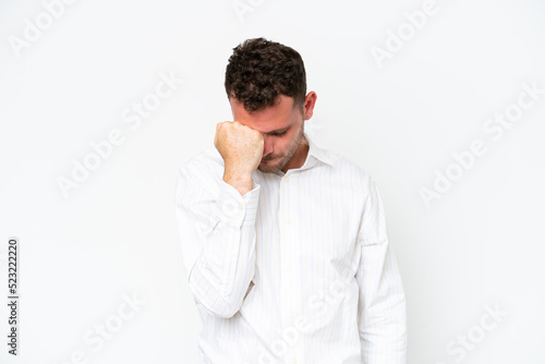 Young caucasian handsome man isolated on white background with headache © luismolinero