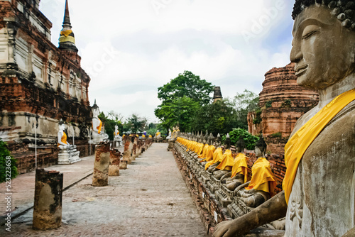 Rows of Buddha statues around the central pillar of Wat Yai Chai Mongkol, Ayutthaya, Thailand.