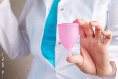 gynecologist holding menstrual cup