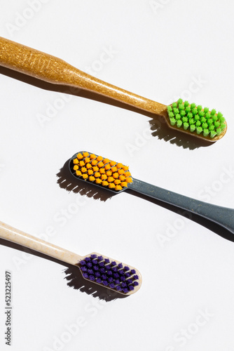 Plastic toothbrushes on white. Dental hygiene concept background