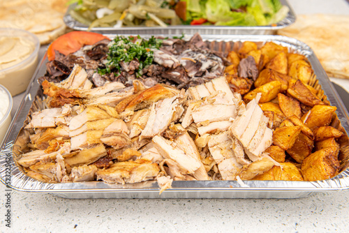 Meat and Chicken mix Shawarma Doner on a plate with Healthy vegetarian salad on white table background