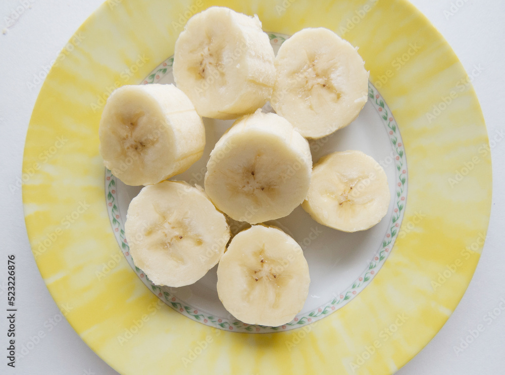 Banana bunch and peeled pieces photo Tropical fruits, banana snack or vegetarian nutrition. Top view Banana bunch and peeled pieces photo Tropical fruits, banana snack or vegetarian nutrition. Top view