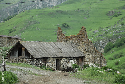 An old stone hut or barn in the mountains