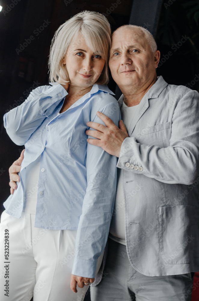 a man and a woman are hugging on a black background a man and a woman are hugging on a black background