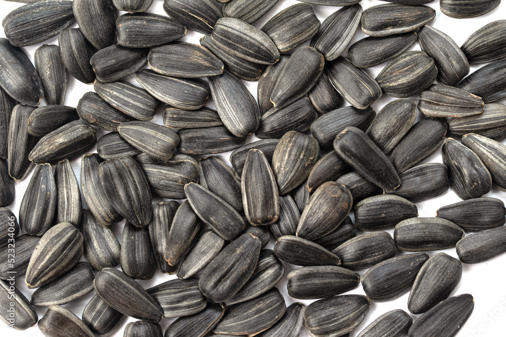 Seeds, sunflower seeds on a white background. Seeds, sunflower seeds on a white background.