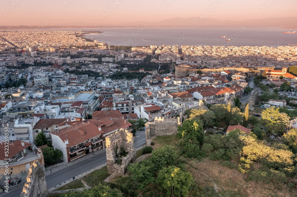 Sunrise cityscape with old Byzantine walls, downtown and living neighborhoods, Thessaloniki, Greece
