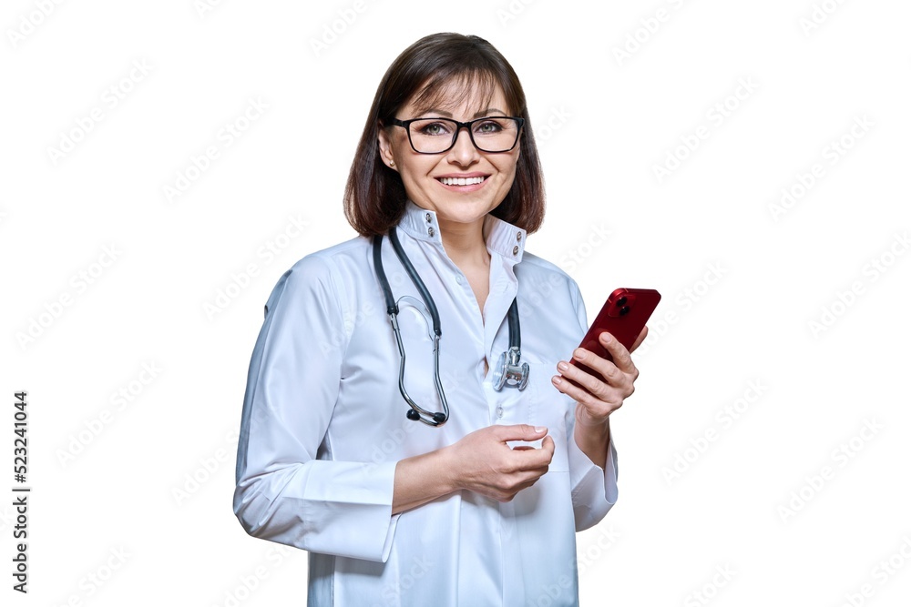 Woman doctor with smartphone looking at camera on white background Woman doctor with smartphone looking at camera on white background