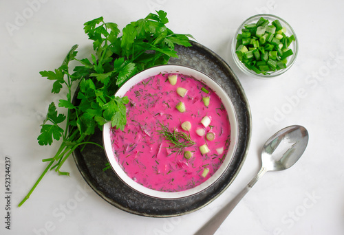 Cold beetroot soup on a light background photo